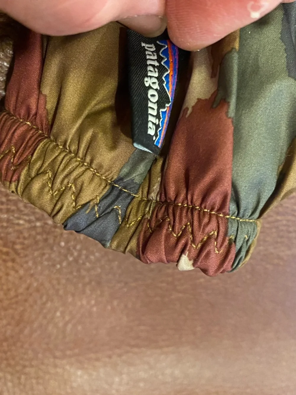 Patagonia Camo-Pattern Quilted Mittens in Olive, Rust, and Tan